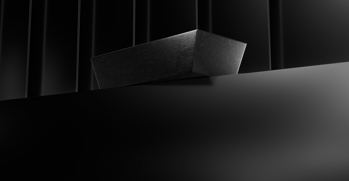 The Tokinvest silver bar suspended in dramatic low light.