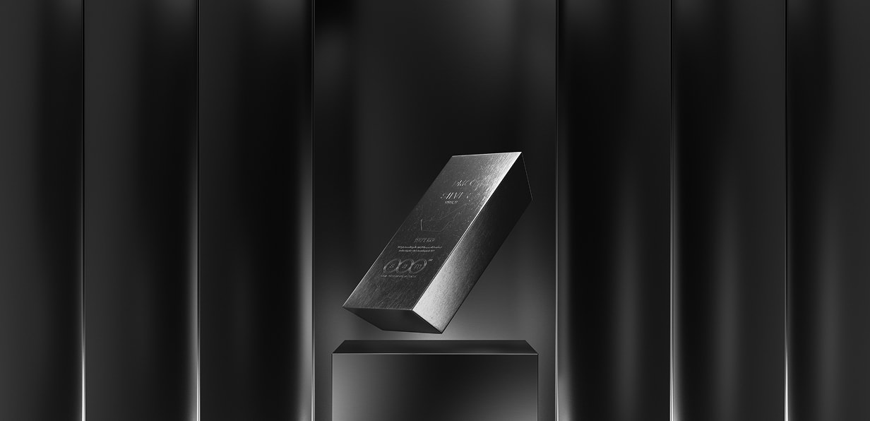 The Tokinvest commemorative silver bar on a plinth, lit dramatically.